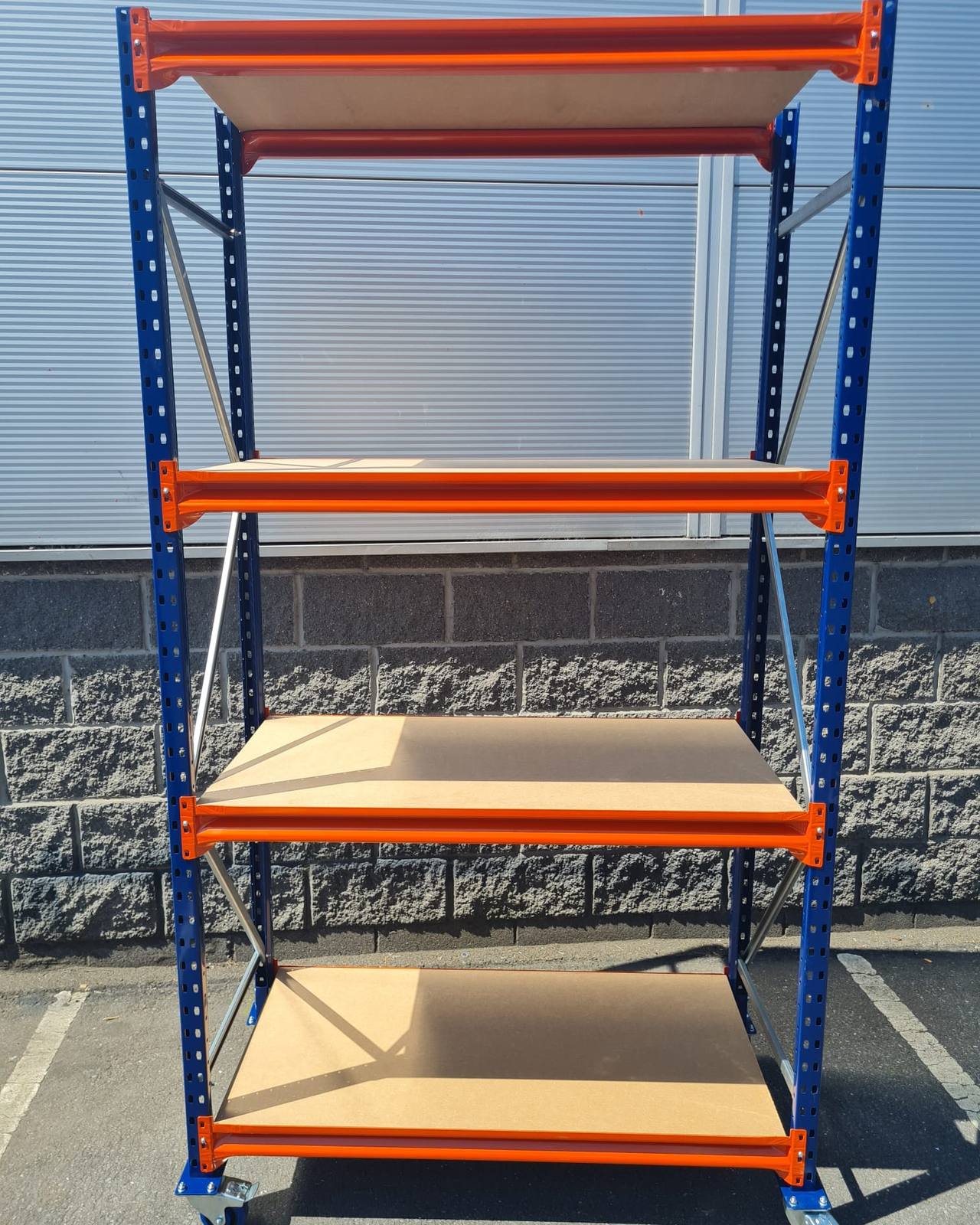Mobile long span shelving bay with timber levels standing on four castors