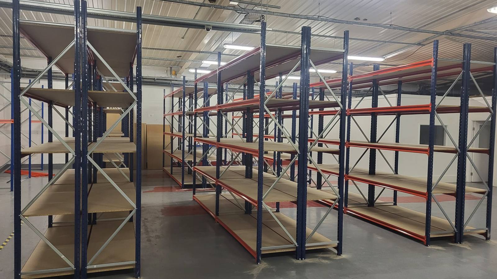 Aisle between long span shelving runs in a warehouse